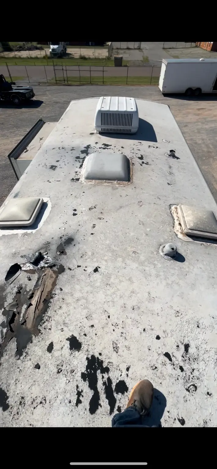 Deteriorated RV roof before restoration